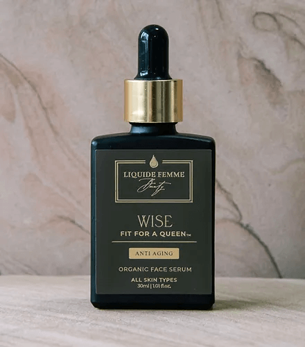 WISE: Fit for a Queen anti-aging organic serum bottle showcasing luxurious ingredients for skin rejuvenation.